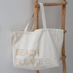 Bolso de playa de lona, color beige, por favor.