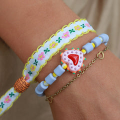 Pulsera tejida flor de algodón blanco/amarillo