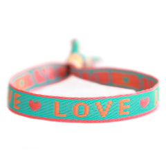 Pulsera tejida «love» verde y naranja