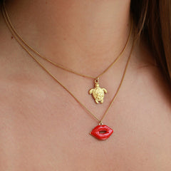 Golden necklace red lips
