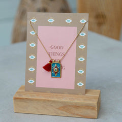 Gold necklace tableau blue