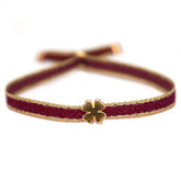 Pulsera tejida trébol burdeos
