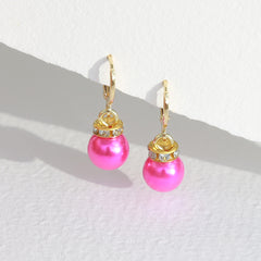 Gouden oorbellen Jingle ball roze