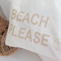 Bolso de playa de lona, color beige, por favor.