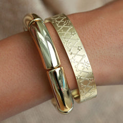 Brazalete pluma de oro