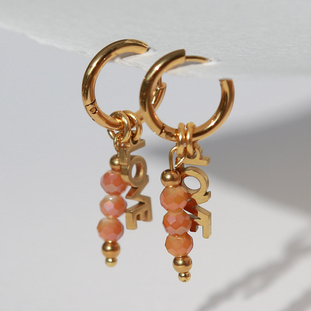 Goldene Ohrringe facettiert Liebe Orange