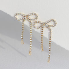 Gouden oorbellen strass strikjes