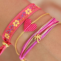 Pulsera tejida flor rosa amarilla