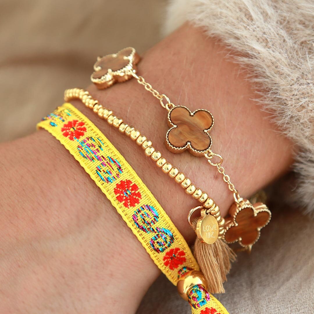 Pulsera tejida flor amarilla