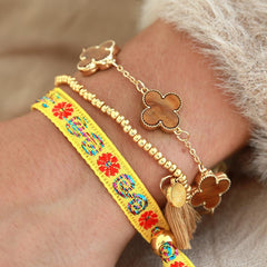 Pulsera tejida flor amarilla