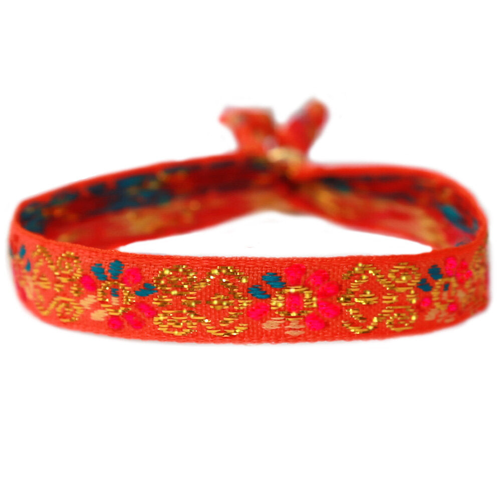 Pulsera tejida flor naranja