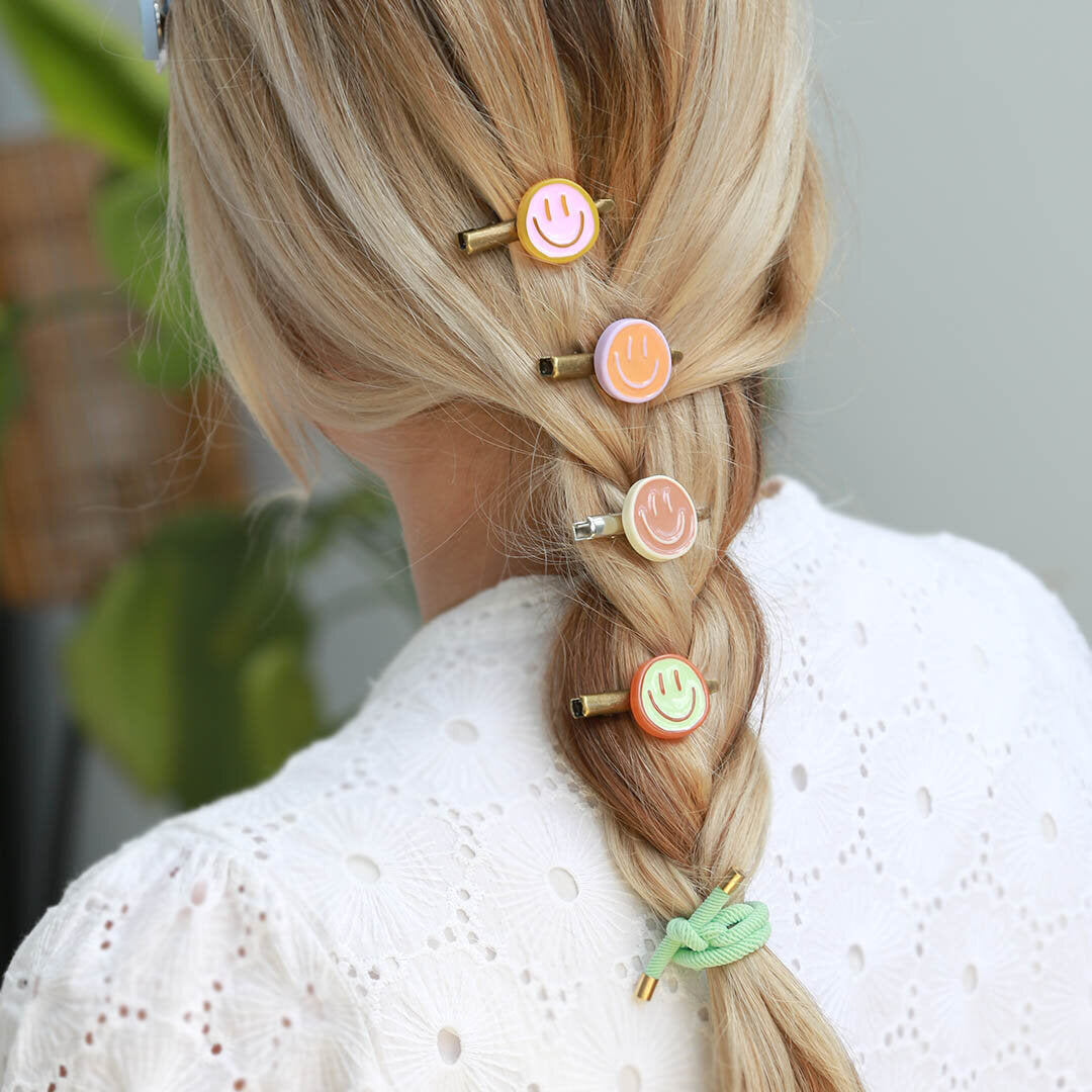Clip para el cabello sonriente naranja lila